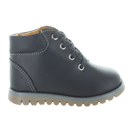 Media bota de piel para niña con detalle metálico en el tobillo mini burbujas vista lateral.